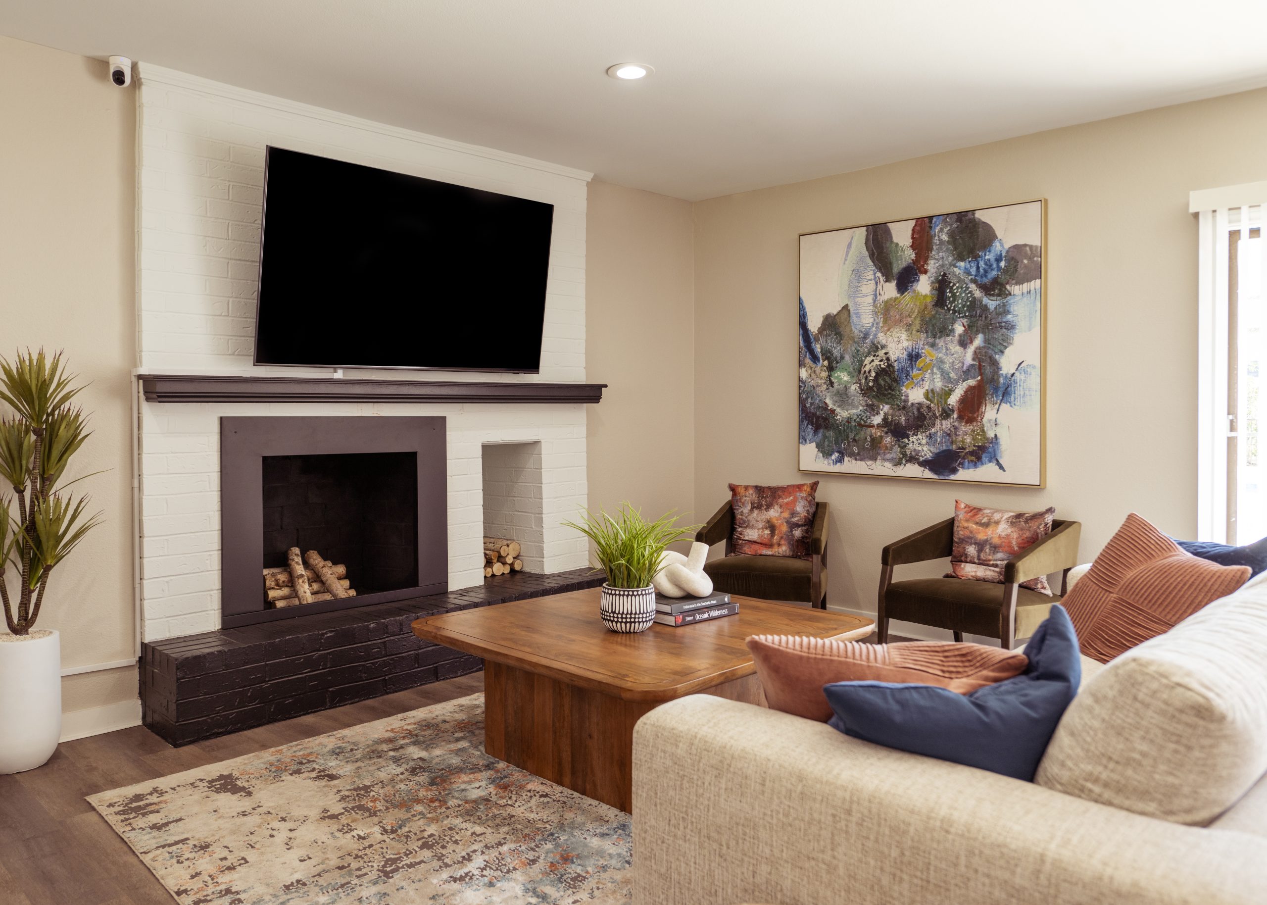 a living room filled with furniture and a fire place